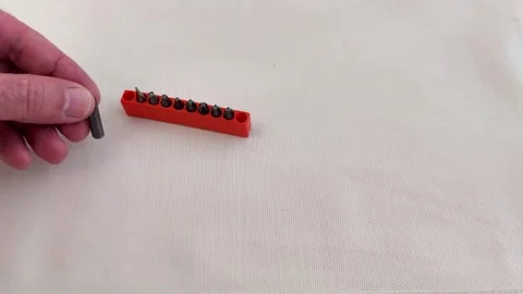 Assorted Screwdriver Bits Organized in Bright Pink Plastic Case Stock-Footage 321449959