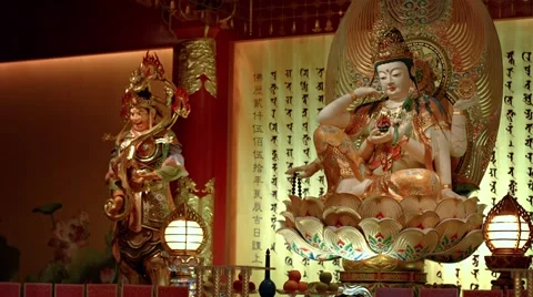 Assorted sculptures of Chinese deities inside a temple in Singapore Stock Footage 68358923