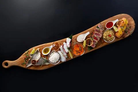 Assorted seafood on plates. Beautiful composition on a served seafood Stock Photos