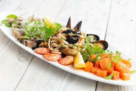 Assorted seafood products. On a light background. Stock Photos