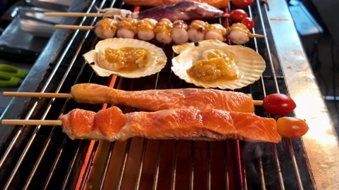 Assorted Seafood Skewers and Shellfish Grilling on Open Flame Barbecue 스톡 동영상 337227888