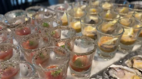 Assorted seashells in short transparent glasses Stock Footage 314708376