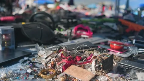 Assorted Secondhand Jewelry Displayed at Outdoor Flea Market Stock Footage 345718791