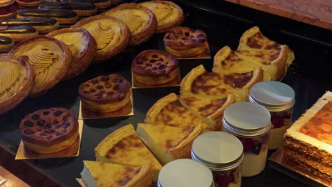 An Assorted Selection of Delicious Pastries and Decadent Desserts Displayed in a Stock Footage 318497080