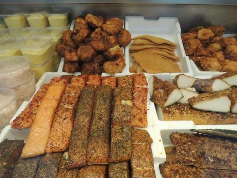 Assorted selection of smoked fish in fish shop Stock Photos