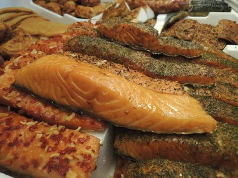 Assorted selection of smoked fish in fish shop Stock Photos