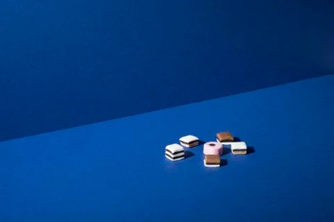 Assorted Shortbread Squares on Blue Background with Copy Space Stock Photos