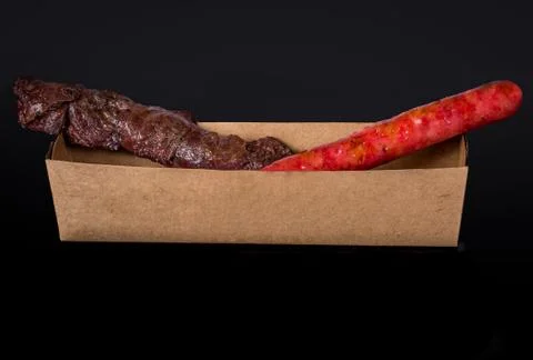 Assorted skewers on black background Stock Photos