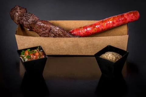 Assorted skewers on black background Stock Photos