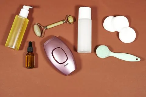 Assorted skincare essentials arranged in a flat lay: jade roller Stock Photos