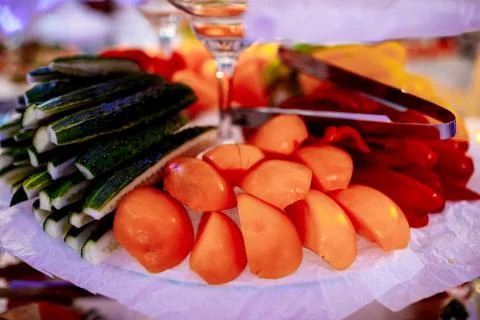 Assorted sliced raw vegetables on plate close up on party. Healthy food. sele Stock Photos