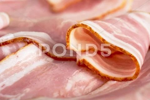 Assorted Slices Of Fat Pink Bacon Background