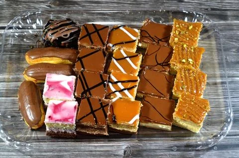 Assorted small Gateaux with different topping, Gateau bites are small bite-.. Stock Photos