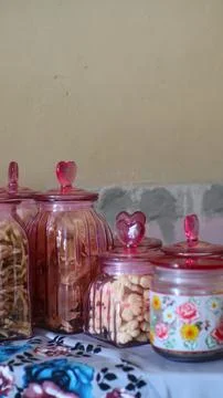 Assorted Snack and Cookie Jars with Heart Shaped Pink Lids Display Stock Photos