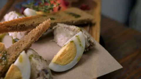 Assorted snack on a wooden board made of bruschetta Stock Footage 148323149