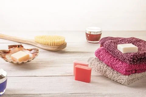 Assorted spa accessories including brush, soap, and body lotion Stock Photos