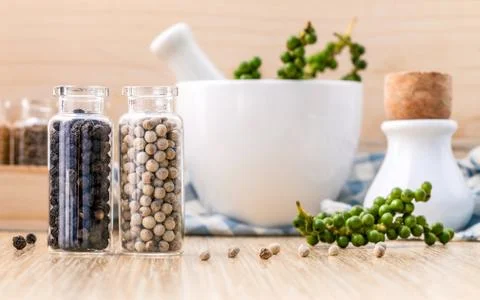 Assorted of spice bottles condiment black pepper ,white pepper and  green pep Stock Photos