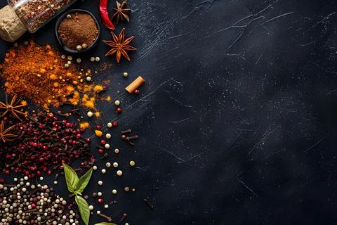 Assorted spices on dark background Stock Photos