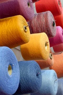 Assorted spools of multi-colored wool threads Stock Photos