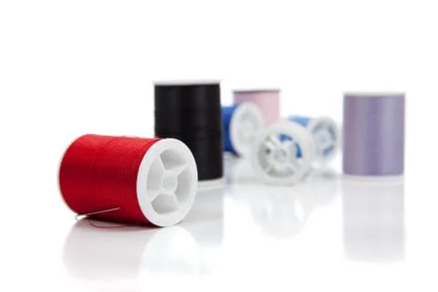 Assorted spools of thread on a white background Stock Photos