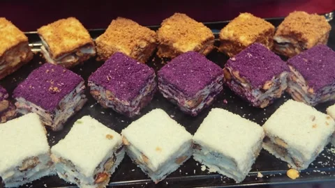 Assorted Square Cakes Arranged on a Serving Tray Stock Footage 342892769