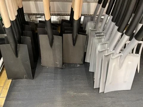 Assorted Stack of Shovels in the Shelf of a Hardware Store Stock Photos