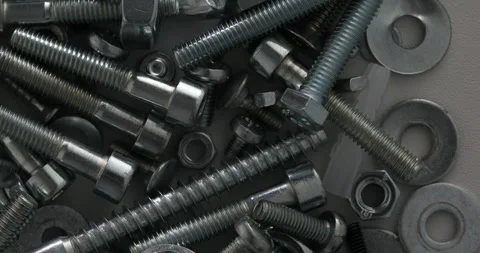 Assorted Steel Bolts, Nuts, and Washers Close-Up Stock Footage 293685376