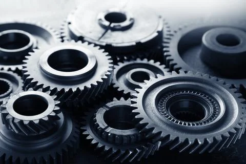 Assorted steel cogs Stock Photos