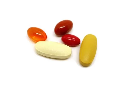 Assorted Supplement Pills Isolated on White Background Stock Photos