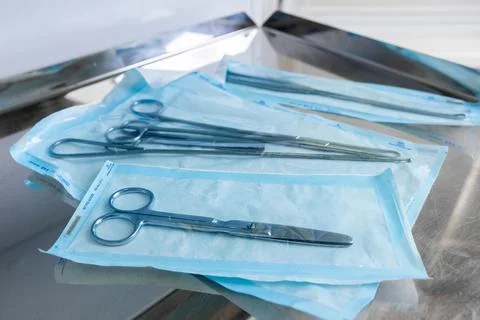Assorted Surgical Scissors Safely Packaged in Sterile Blue Wrappers Ready for Stock Photos