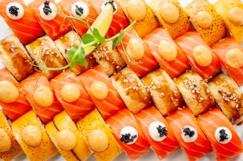 Assorted sushi big set close-up background. A variety of Japanese sushi. Stock Photos