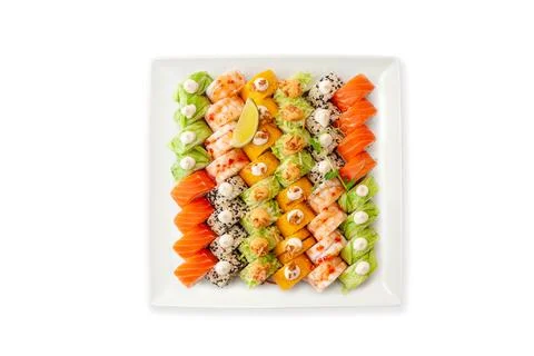 Assorted sushi big set on a white plate isolated. A variety of Japanese sushi Stock Photos