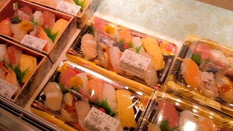 Assorted sushi boxes sold on food street in japan Stock Footage 132014361
