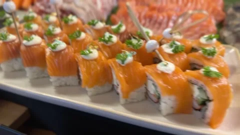 Assorted sushi with fresh salmon, tuna, and other varieties Stock Footage 314707992