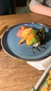 Assorted Sushi Nigiri and Roll on Blue Plate Stock Photos
