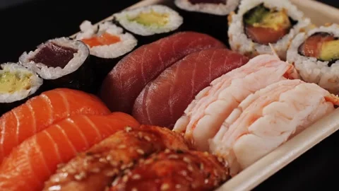 An Assorted Sushi Platter Featuring a Beautiful Array of Fresh Ingredients and Stock Footage 285178152