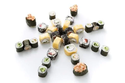 Assorted sushi rolls arranged in a star shape on white Stock Photos