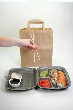 Assorted sushi rolls on an isolated white background. Delivery of Japanese Stock Photos