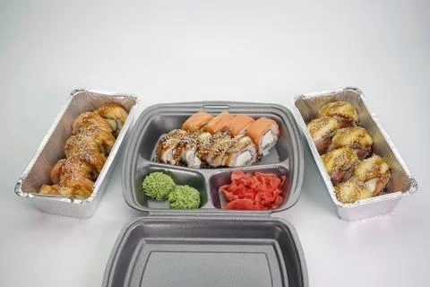 Assorted sushi rolls on an isolated white background. Delivery of Japanese Stock Photos