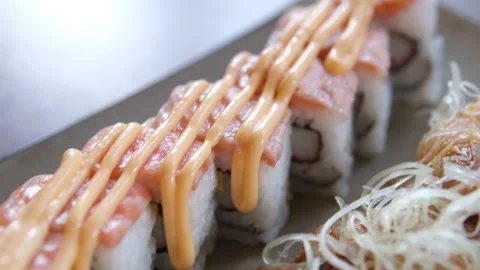 Assorted Sushi Rolls Platter: Salmon, Tuna, and California Rolls Stock Footage 316057518