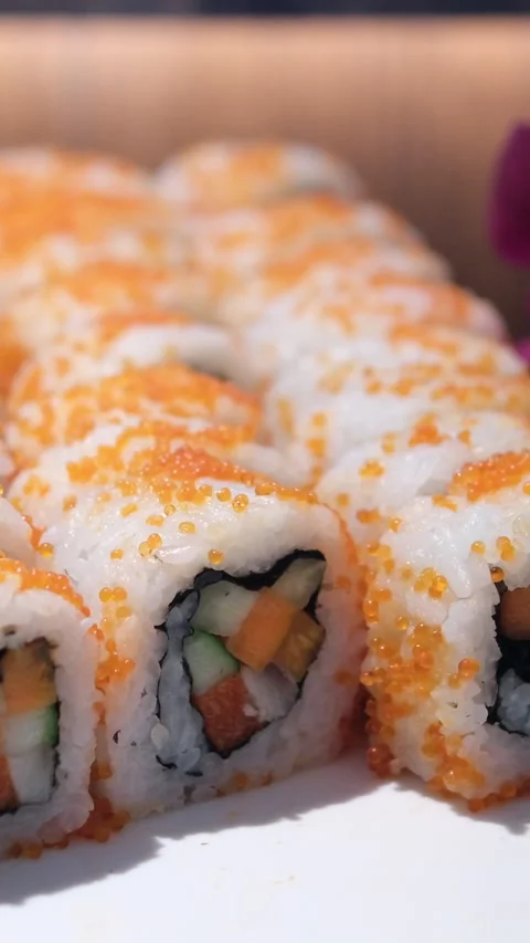 Assorted Sushi Rolls Platter: Salmon, Tuna, and California Rolls Stock-Footage 316954035