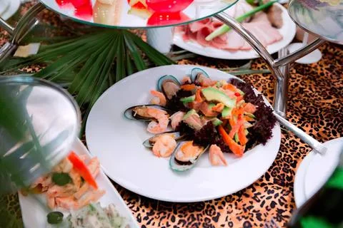 Assorted sushi rolls on a white plate with soy sauce 写真素材