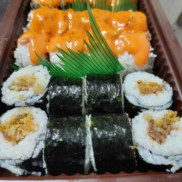 Assorted sushi served in a container Stock Photos