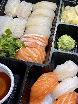 Assorted sushi set, featuring a variety of traditional Japanese dishes. Per.. Stock Photos