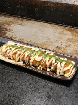 Assorted sushi set, featuring a variety of traditional Japanese dishes. Per.. Stock Photos