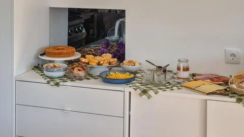 Assorted Sweet and Savory Breakfast Buffet on a Sideboard Stock Photos