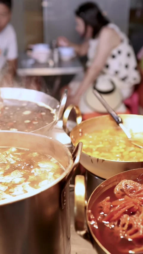 Assorted Sweet Beans and Lotus Root Simmering at Bangkok Street Stall Stock Footage 317133769