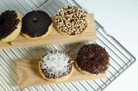 Assorted Sweet Donuts Ready for Enjoyment Stock Photos