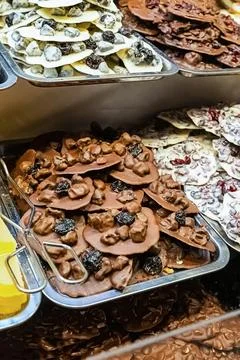 Assorted sweets dark and milk chocolate with prunes, pastry counter Stock Photos