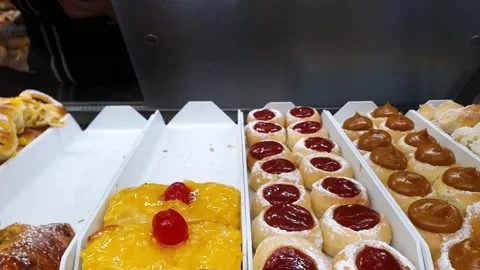 Assorted sweets with dulce de leche, guava paste, pastry cream and coconut .. Stock Footage 301320158